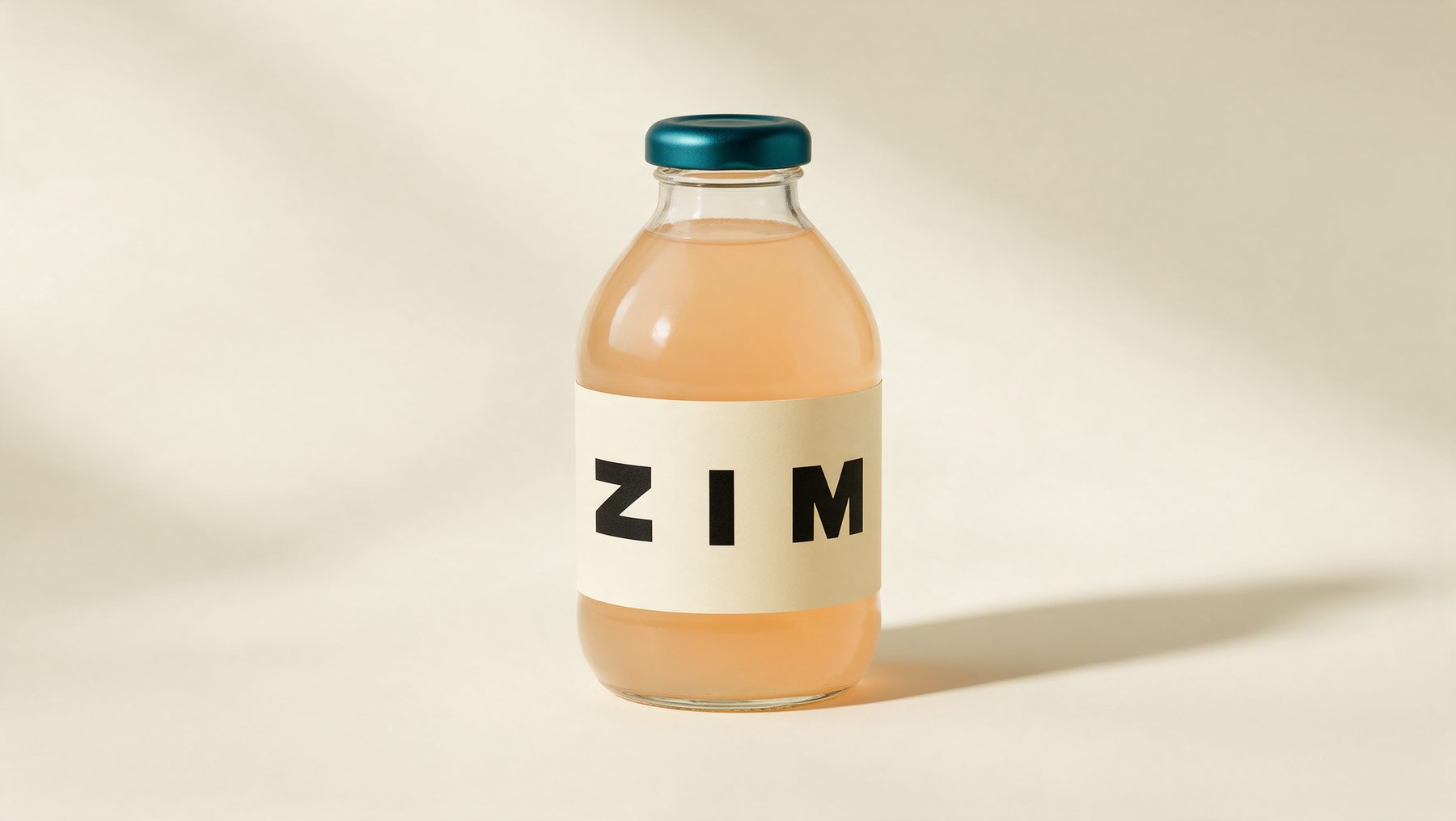 Studio packshot of the ZIM bottle on a cream seamless backdrop